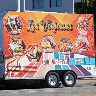 a food truck parked in front of a building
