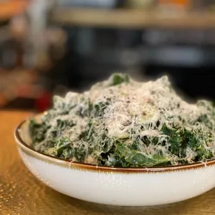 a bowl of spinach and cheese