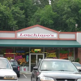 cars parked in front of store