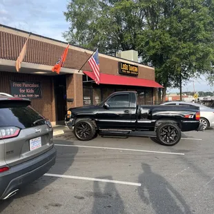 a pickup truck parked in a parking lot