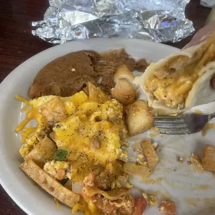 Half eaten migas and a taco I made.
