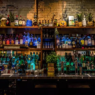 a bar filled with bottles of alcohol