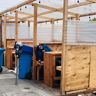 a man sleeping in a shelter