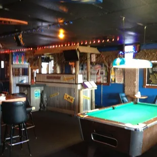 a pool table in a bar