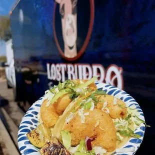 a person holding a plate of food