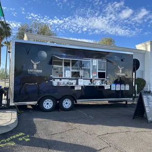 a food truck parked in a parking lot