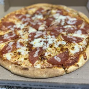 Pizza topped with peperoni