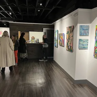 Andy J Mosure and Vicky Shaffer White art on display.