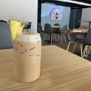 a drink with a pineapple garnish