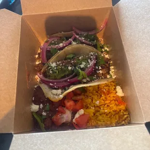 Caritas tacos with green chili
