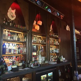 a bar filled with bottles of alcohol