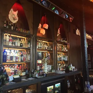 a bar filled with bottles of alcohol