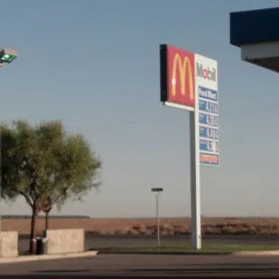 a mcdonald&apos;s sign in a parking lot