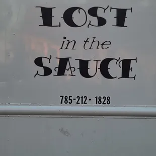 a sign on a food truck