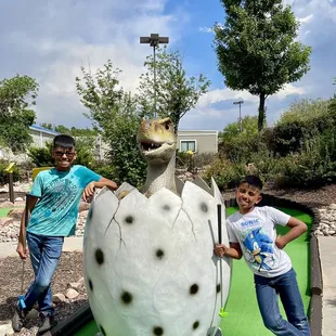 Our grandsons enjoying miniature golf
