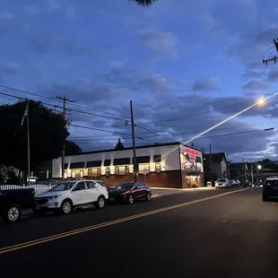 cars parked in front of a restaurant