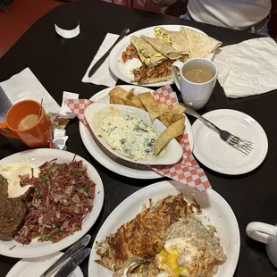 Top: eggsadillas;  mid: spinach dip;  bot left: corn beef hash;  bit right: country benedict;