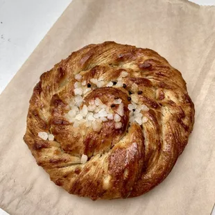 Cardamom bun - traditional Swedish sweet roll highlighting cardamom and topped with pearl sugar