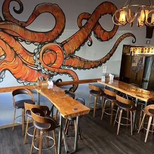 an octopus mural on the wall of a restaurant