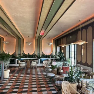 a woman sitting at a table in a restaurant
