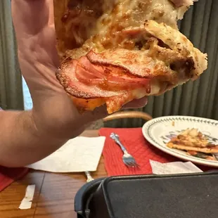 The stack of meat on one slice