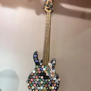 a guitar made out of buttons