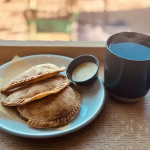 a plate of pastries and a cup of coffee