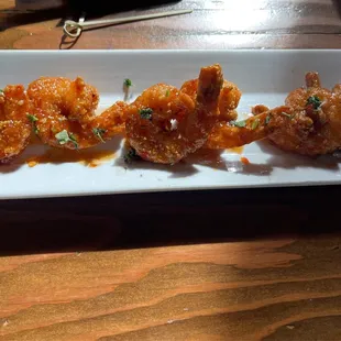 Thai Shrimp - 6 breaded and fried shrimp tossed in spicy Thai sauce.