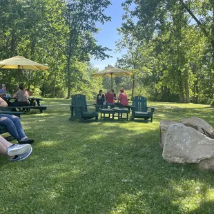 a group of people sitting around a fire pit