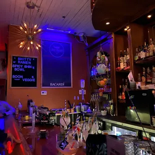 a bar with a neon sign