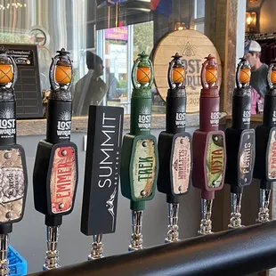 a row of beer taps