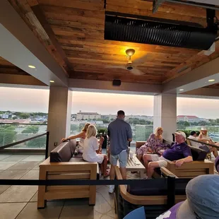 a group of people sitting and standing