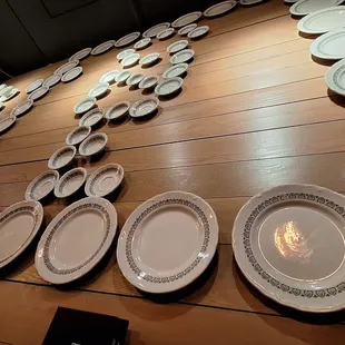 Random plates on a wall that happen to be their logo.