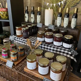 a display of various jars of olive oil