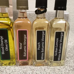 four bottles of olive oil