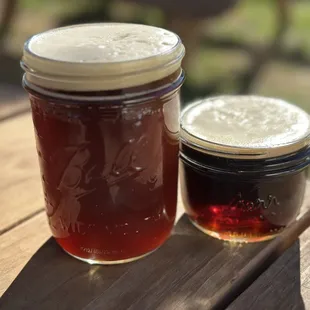 two jars of beer on a table