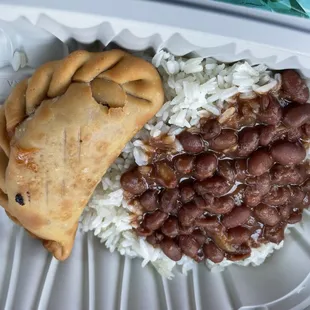 Rice, beans, and empanada de pizza. It's part of their kids menu.