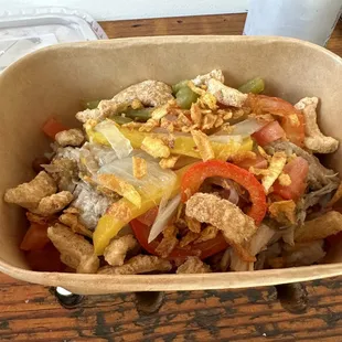 BYOB - with Roast Pork, Arañitas (Plantain), roasted peppers and onions over white rice and stewed beans.