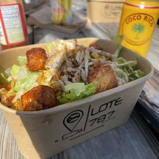 a takeout container of a salad
