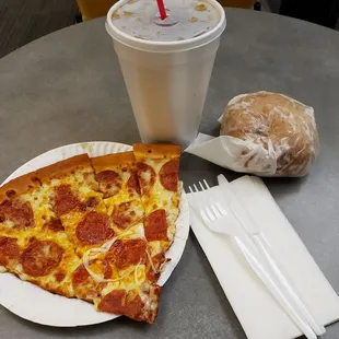 One slice of delicious pepperoni pizza, soda, garlic knot