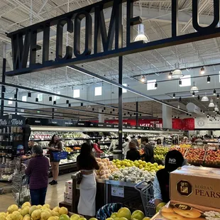 people shopping in the produce section