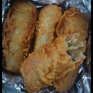 Crispy  LARGE Egg rolls packed full of crunchy cabbage, ground chicken, carrots, onions, respect and a pinch of hospitality.