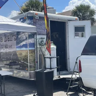 a food truck and tables
