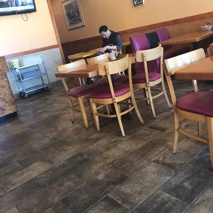 a man sitting at a table in a restaurant