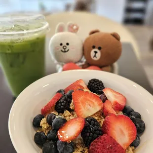 Matcha Latte with Oat Milk and a yogurt bowl... portrait mode