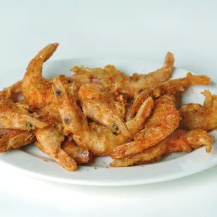 a plate of fried chicken wings