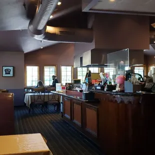 the inside of a restaurant with a bar