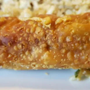 a plate of food with rice and meat