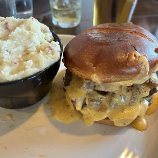 Super tender and cheesy Short Rib Sandwich with homemade mashed potatoes.