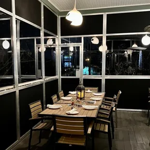 a dining room with a table and chairs